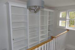 White painted wooden bespoke bookshelves