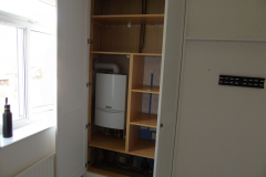 bespoke built in cupboards & storage housing boiler